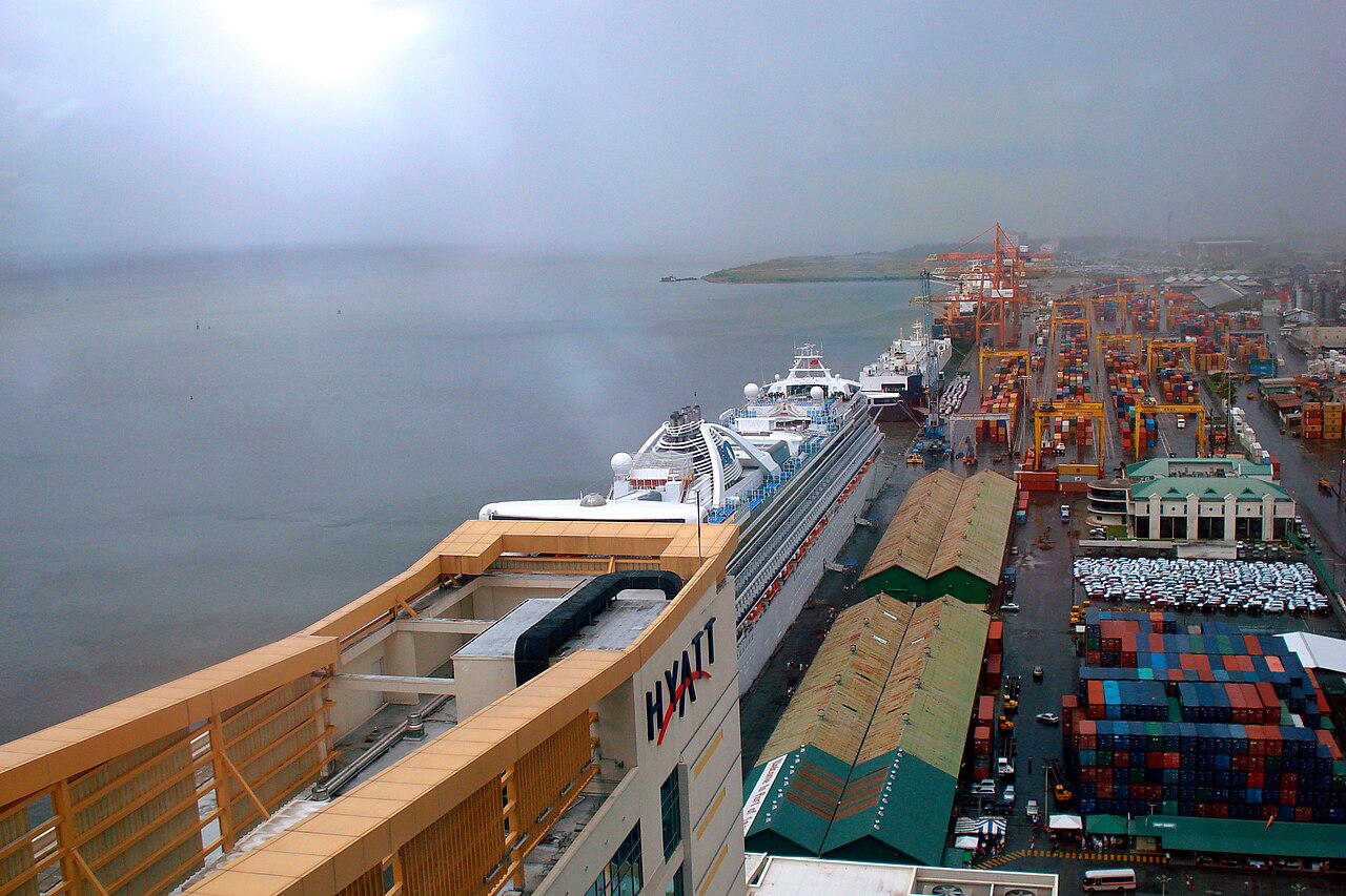 A cruise ship and cargo containers at Port of Spain harbour. File photo; not the reported event.