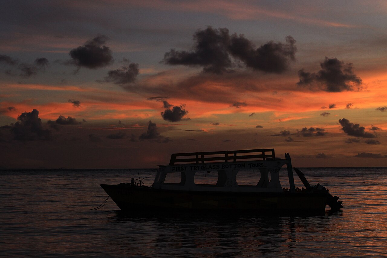 A glass-bottom tour boat at Pigeon Point, Tobago, at sunset. File photo; not the reported event.